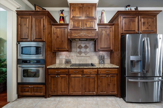 7808 Pineridge Dr, Amarillo, TX 79119 - kitchen with appliances with stainless steel finishes, crown molding, light stone countertops, tasteful backsplash, and light tile patterned floors