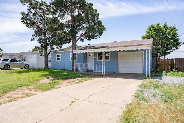 3804 NE 26th Ave, Amarillo, TX 79107 - ranch-style home with an attached garage, a porch, and driveway