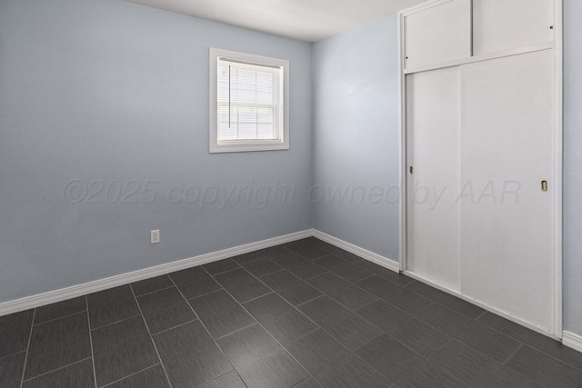 3804 NE 26th Ave, Amarillo, TX 79107 - unfurnished bedroom with baseboards and a closet