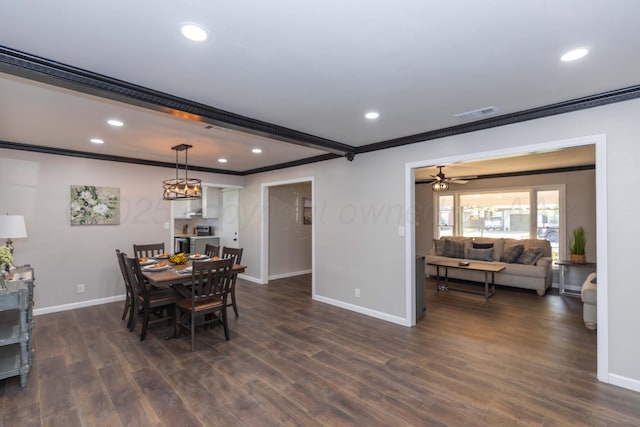 dining space with crown molding, baseboards, visible vents, and dark wood-style floors