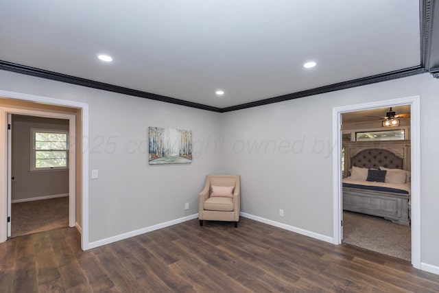 unfurnished room featuring crown molding, recessed lighting, baseboards, and dark wood finished floors