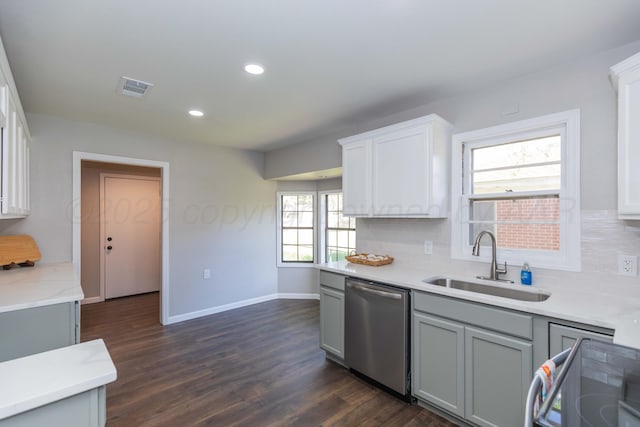 kitchen featuring a sink, gray cabinets, stainless steel dishwasher, and stove