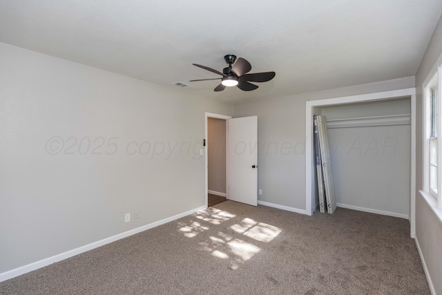 unfurnished bedroom featuring a closet, baseboards, carpet flooring, and visible vents