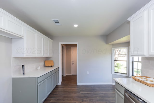 kitchen featuring decorative backsplash, recessed lighting, baseboards, and dark wood-style floors