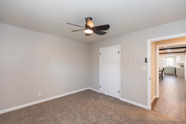 unfurnished bedroom with baseboards, a ceiling fan, and carpet floors