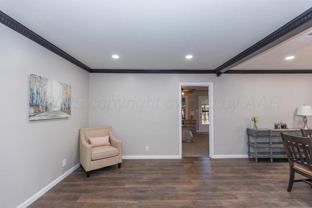 sitting room featuring baseboards, ornamental molding, recessed lighting, and wood finished floors