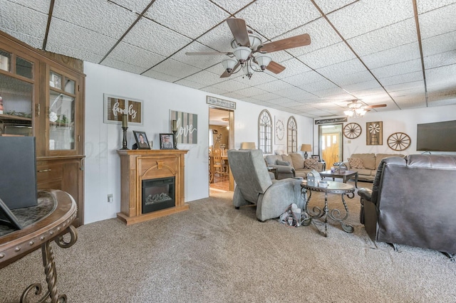 living room featuring ceiling fan and carpet floors