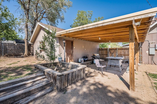 view of patio / terrace featuring an outdoor fire pit