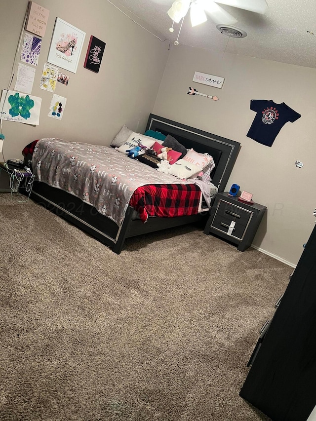 carpeted bedroom featuring ceiling fan, a textured ceiling, and lofted ceiling