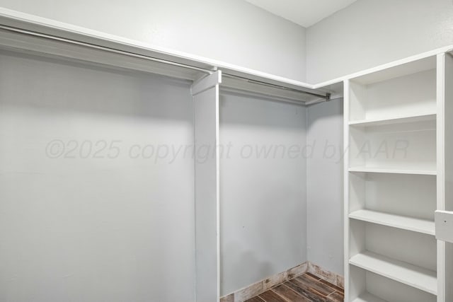 227 Inverness St, Borger, TX 79007 - spacious closet featuring dark wood-style floors