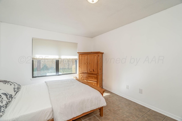 3000 Fleetwood Dr, Amarillo, TX 79109 - bedroom featuring baseboards and light tile patterned floors