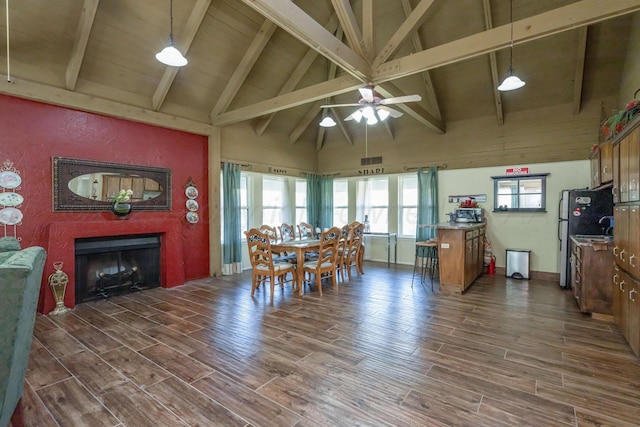 3000 Fleetwood Dr, Amarillo, TX 79109 - dining area featuring a fireplace, ceiling fan, high vaulted ceiling, dark wood-style floors, and beam ceiling