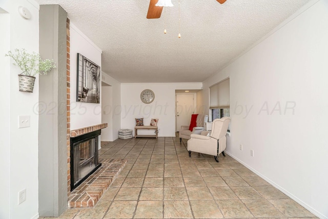 3000 Fleetwood Dr, Amarillo, TX 79109 - living area featuring a ceiling fan, a textured ceiling, light stone finish floors, and a fireplace