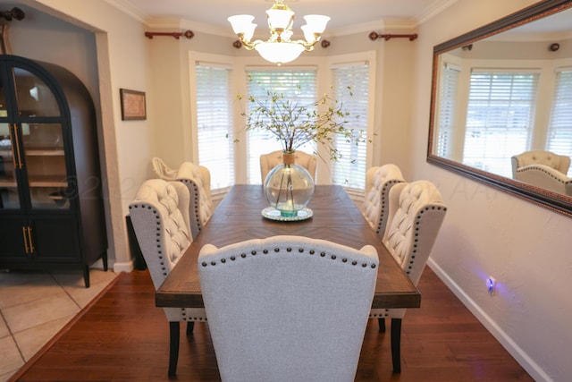 210 Ranger St, Hereford, TX 79045 - dining space with a chandelier, crown molding, healthy amount of natural light, and wood finished floors