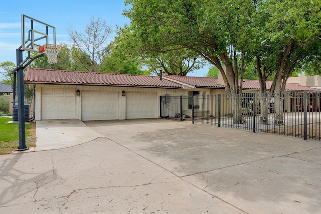 3408 Carlton Dr, Amarillo, TX 79109 - view of front of house with a tiled roof, cooling unit, and stucco siding