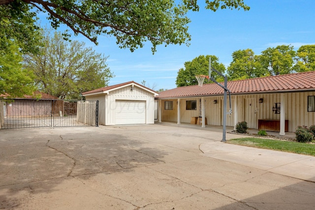 3408 Carlton Dr, Amarillo, TX 79109 - ranch-style house featuring concrete driveway, a detached garage, an outdoor structure, a gate, and a tile roof