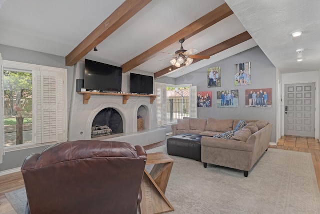 3408 Carlton Dr, Amarillo, TX 79109 - living area featuring a fireplace with raised hearth, healthy amount of natural light, a ceiling fan, and light wood-type flooring