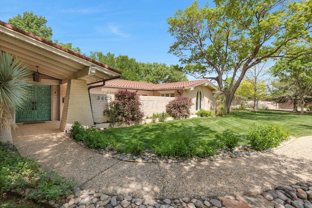 3408 Carlton Dr, Amarillo, TX 79109 - view of side of home with brick siding and a tile roof