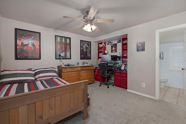 3408 Carlton Dr, Amarillo, TX 79109 - bedroom with an office area, light carpet, baseboards, ensuite bathroom, and a ceiling fan