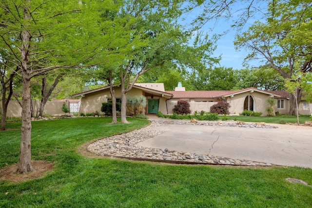 3408 Carlton Dr, Amarillo, TX 79109 - view of front facade featuring a chimney, stucco siding, and a tiled roof