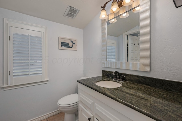 3408 Carlton Dr, Amarillo, TX 79109 - half bath featuring vanity, toilet, and baseboards