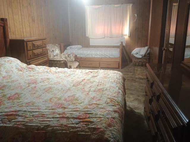 bedroom with wood walls