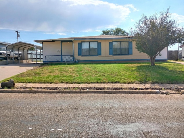 905 Harrington St, Borger, TX 79007 - view of front facade featuring a detached carport and a front yard