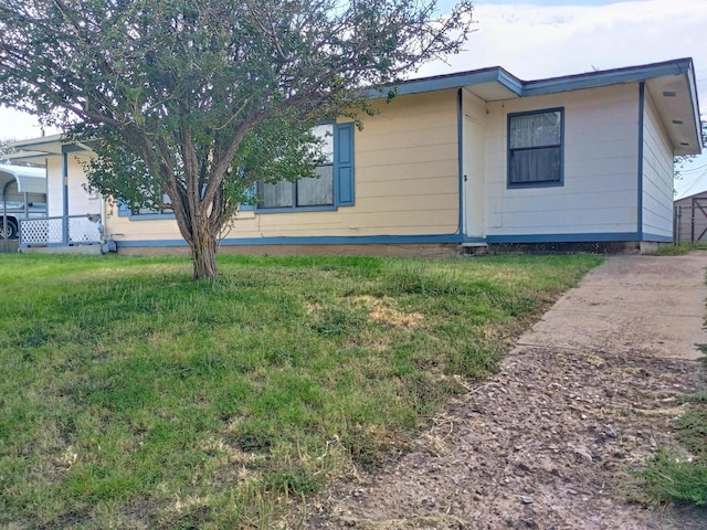 view of property exterior with a lawn