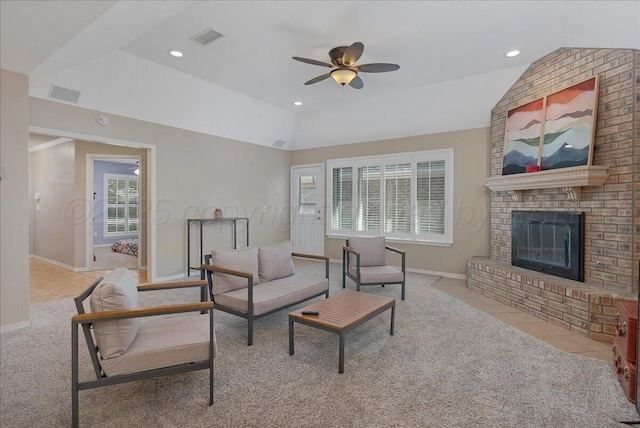 3507 Brennan Gdns, Amarillo, TX 79121 - living area with lofted ceiling, a ceiling fan, tile patterned floors, carpet, and a brick fireplace