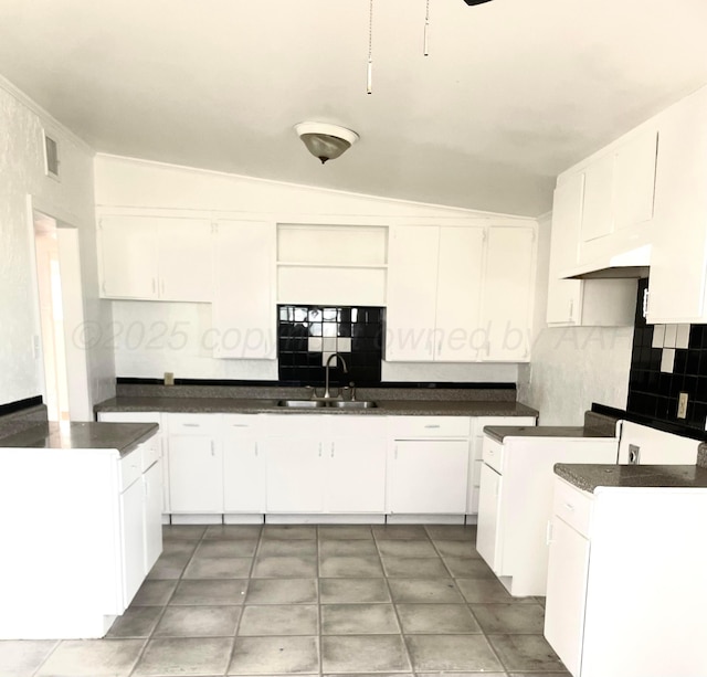 4412 S Hughes St, Amarillo, TX 79110 - unfurnished bedroom featuring wood finished floors, a closet, ceiling fan, vaulted ceiling, and built in desk