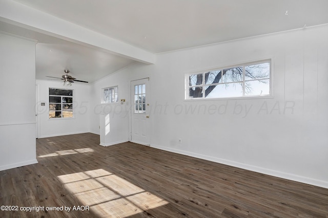 interior space featuring a ceiling fan, baseboards, vaulted ceiling with beams, and wood finished floors