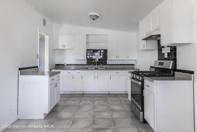 kitchen with visible vents, stainless steel gas range oven, open shelves, a sink, and under cabinet range hood