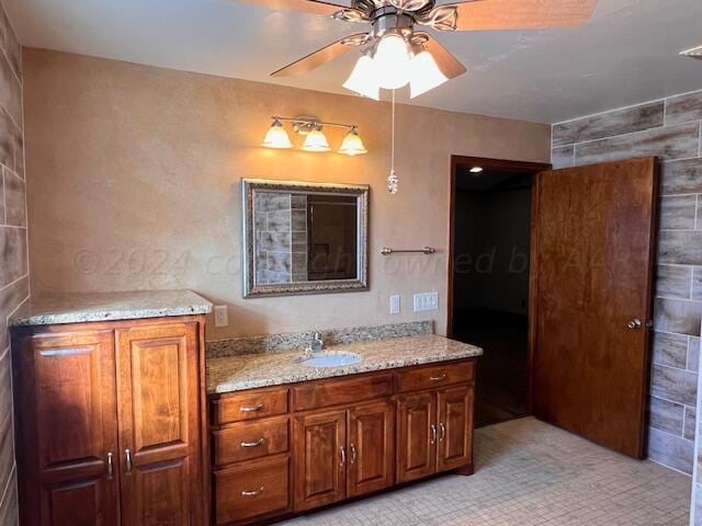 bathroom featuring vanity and ceiling fan