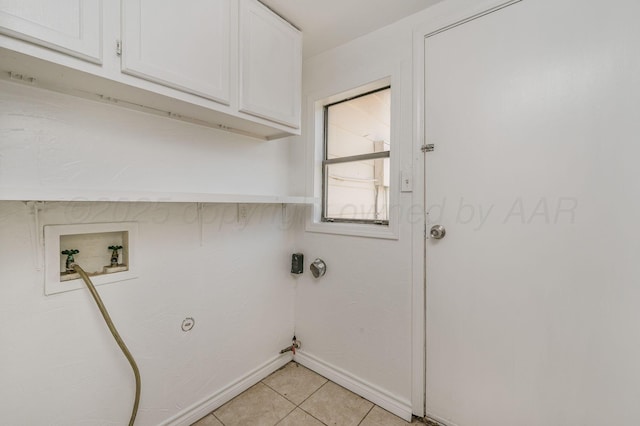 4004 S Van Buren St, Amarillo, TX 79110 - laundry room featuring cabinet space, hookup for a gas dryer, light tile patterned floors, and hookup for a washing machine