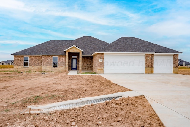 single story home featuring a garage