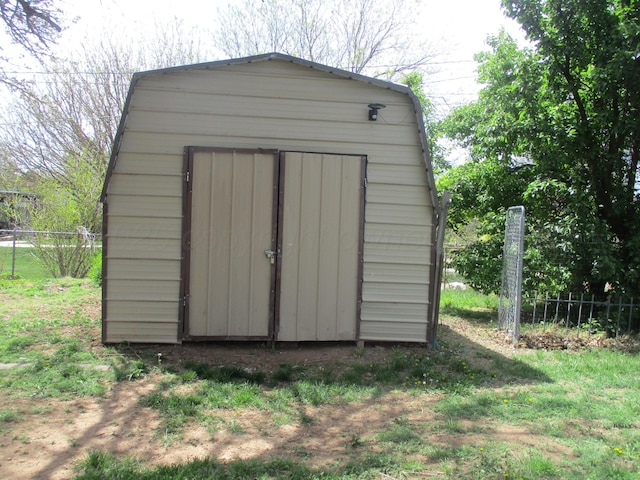 view of shed with fence