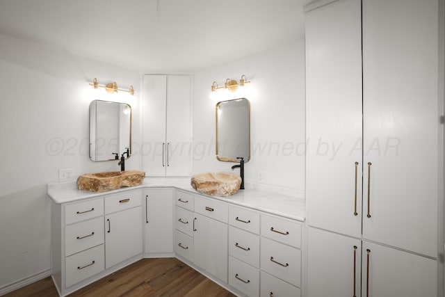 bathroom with vanity and hardwood / wood-style flooring