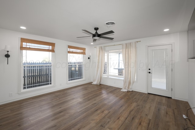 interior space featuring ceiling fan and dark hardwood / wood-style flooring