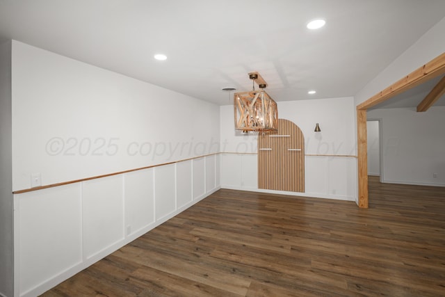 unfurnished dining area with dark hardwood / wood-style floors