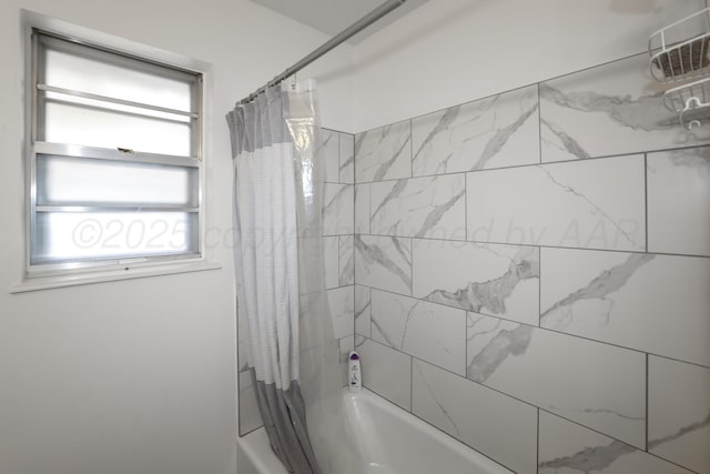 bathroom with shower / tub combo