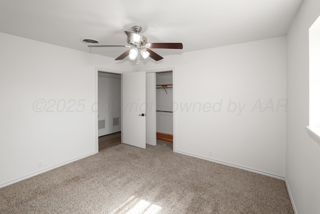 unfurnished bedroom with carpet floors, ceiling fan, and a closet