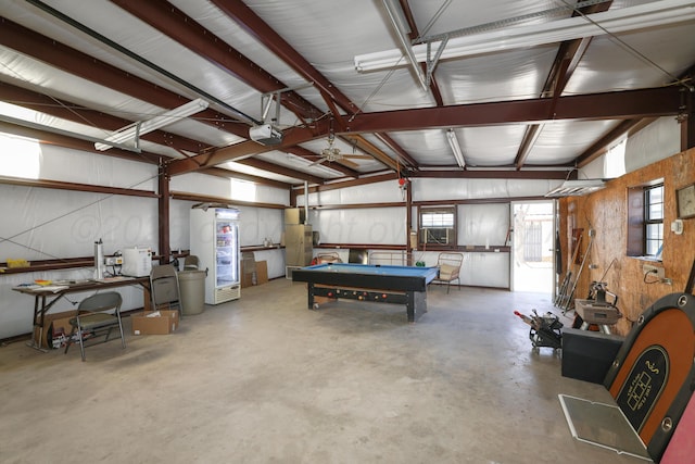 garage featuring a garage door opener and refrigerator