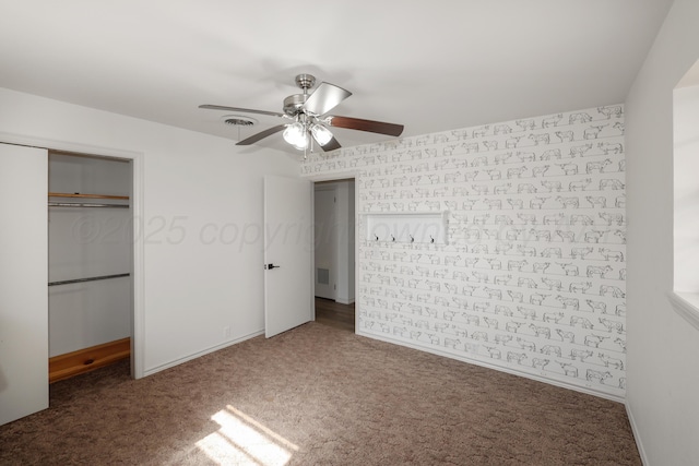 unfurnished bedroom with carpet floors, ceiling fan, and a closet