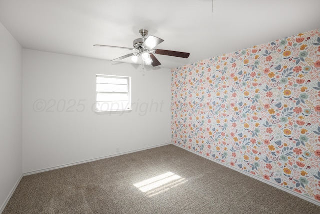 spare room with carpet floors and ceiling fan