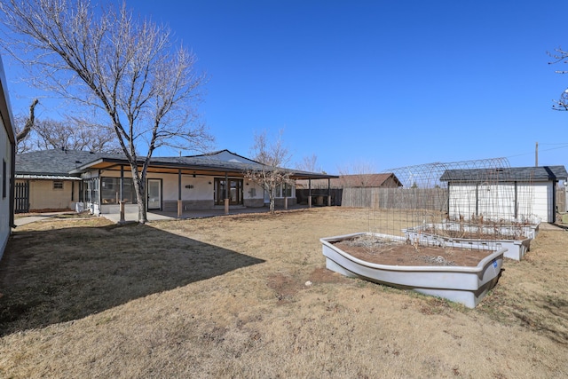 view of yard with a sunroom