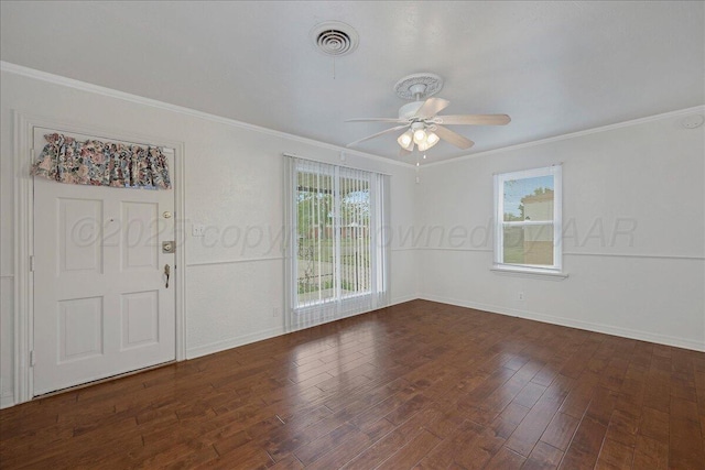spare room featuring ceiling fan, wood finished floors, and ornamental molding