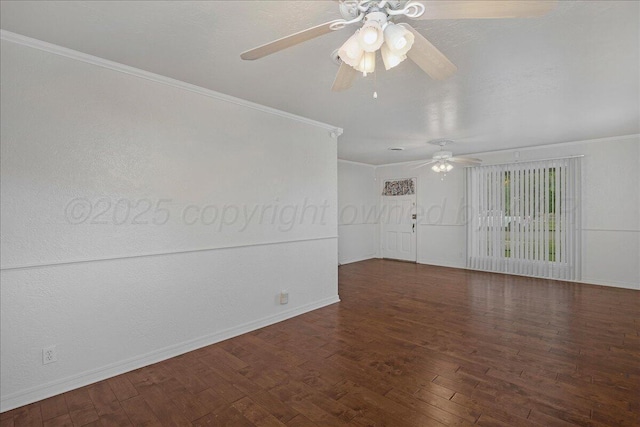 empty room with ornamental molding, wood finished floors, baseboards, and ceiling fan