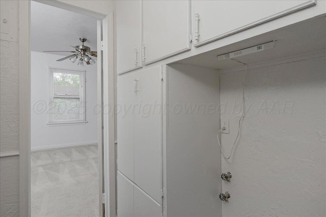 interior details with ceiling fan, carpet floors, and baseboards