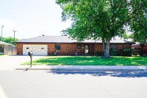 8403 Whittier Dr, Amarillo, TX 79110 - ranch-style home with concrete driveway, an attached garage, and a front yard