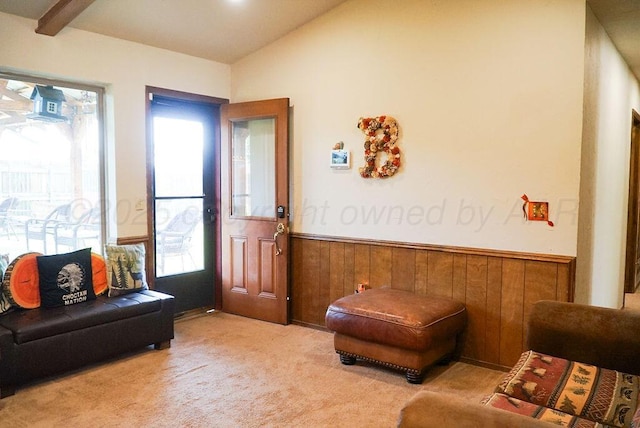 8403 Whittier Dr, Amarillo, TX 79110 - carpeted living area with a wainscoted wall, vaulted ceiling, and wood walls